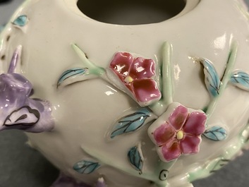 A pair of Chinese famille rose relief-decorated teapots with floral design, Yongzheng